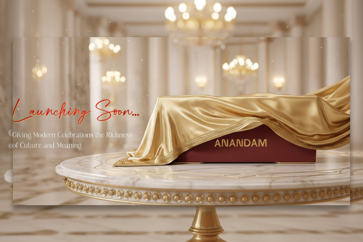 Gold-draped table with 'ANANDAM' branding in a luxurious setting